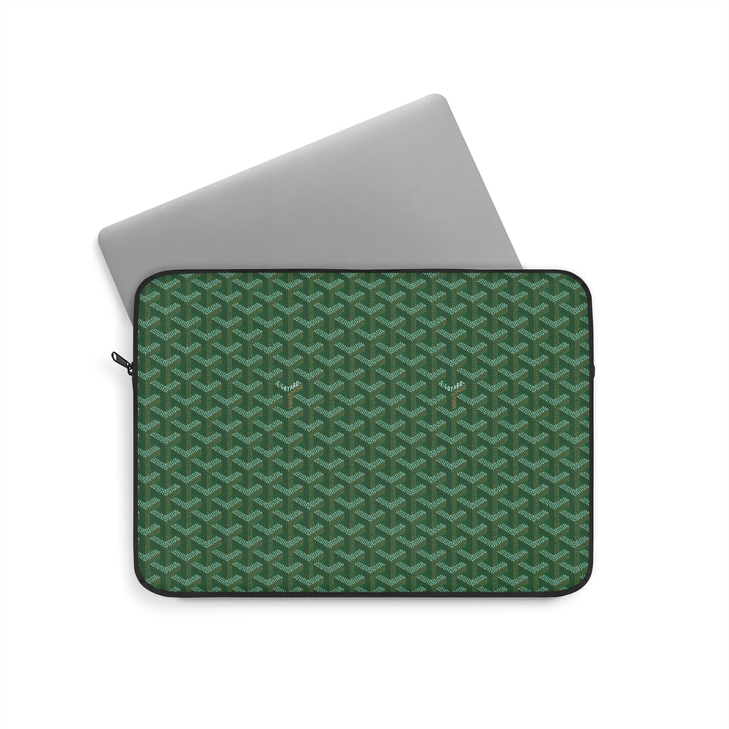 Green Goyard-style laptop sleeve with geometric pattern and zip closure
