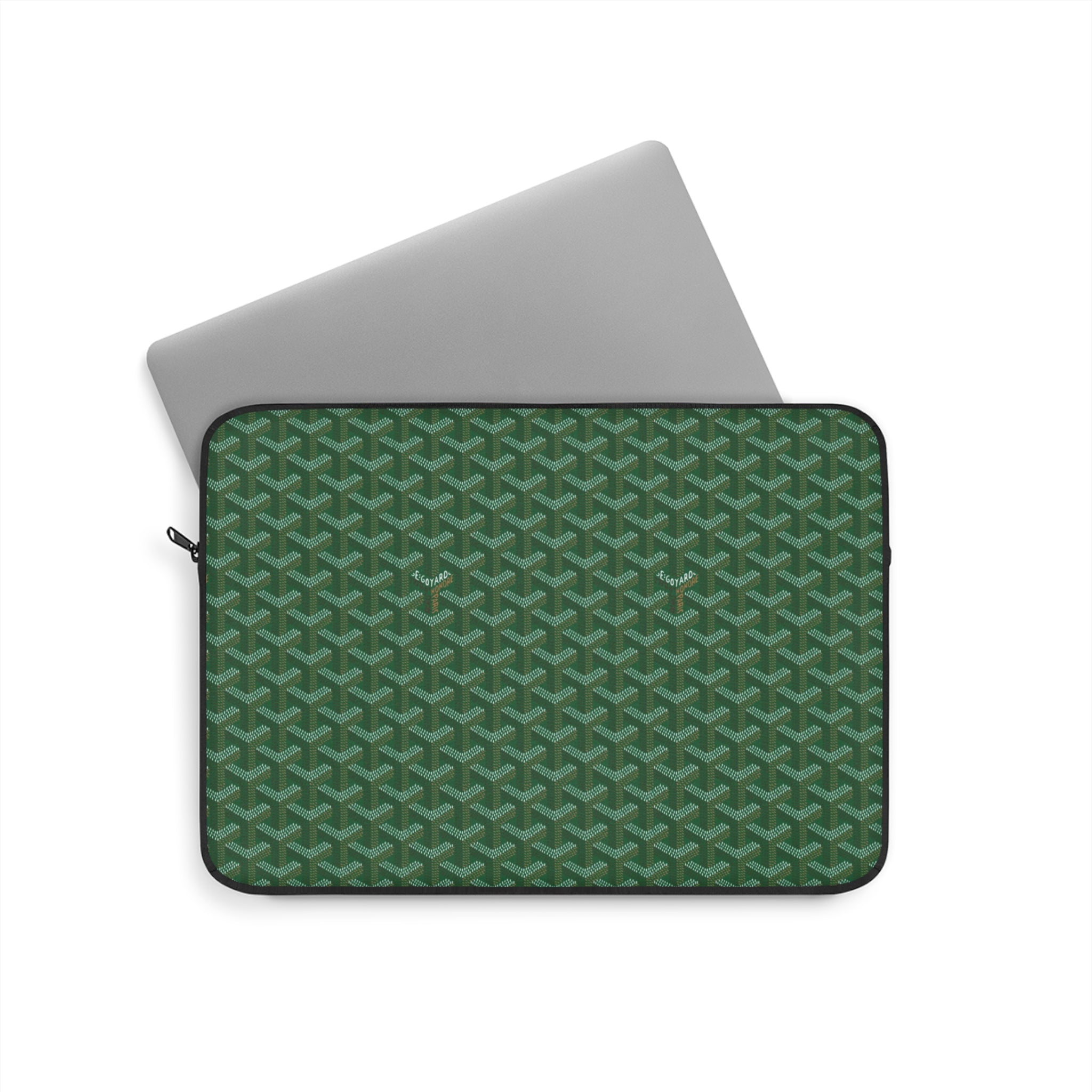Green Goyard-style laptop sleeve with geometric pattern and zip closure