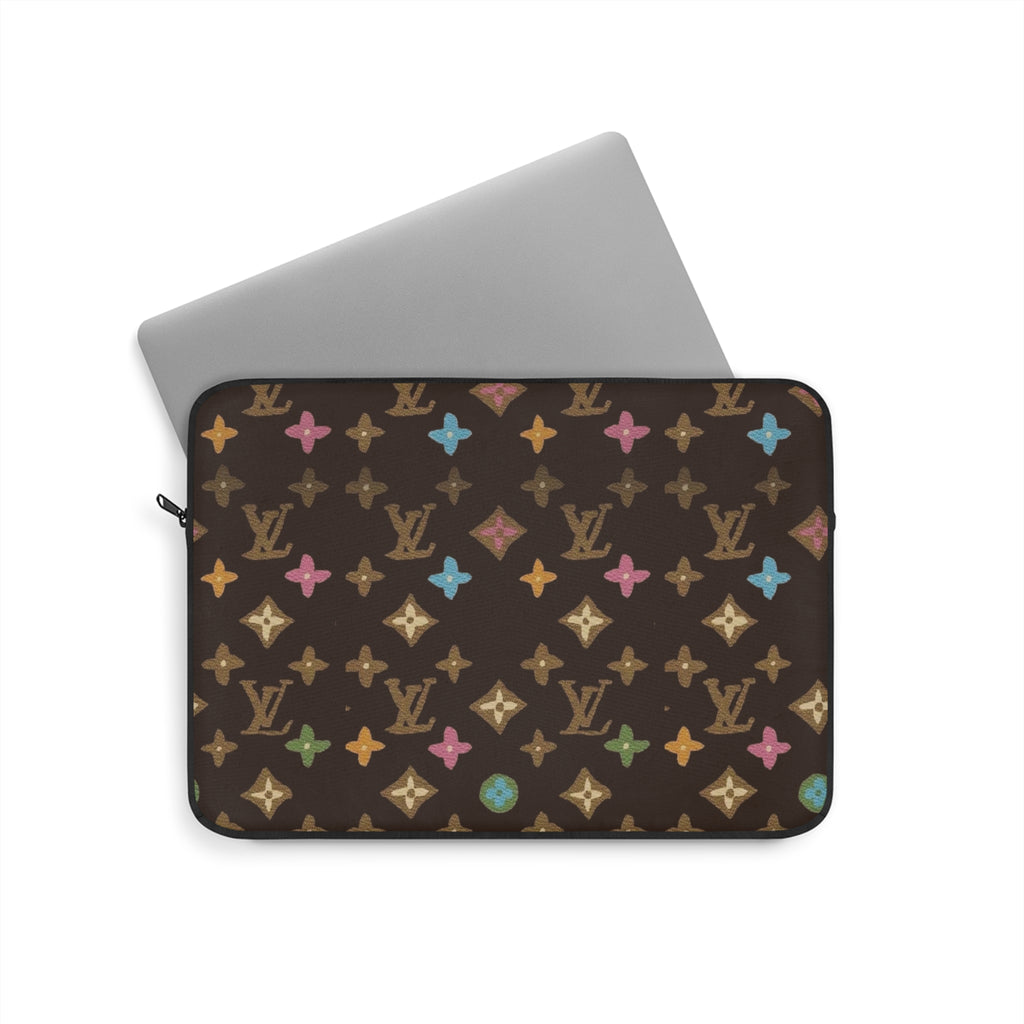 Brown laptop sleeve with multicolor monogram star pattern, zippered top and carrying strap.