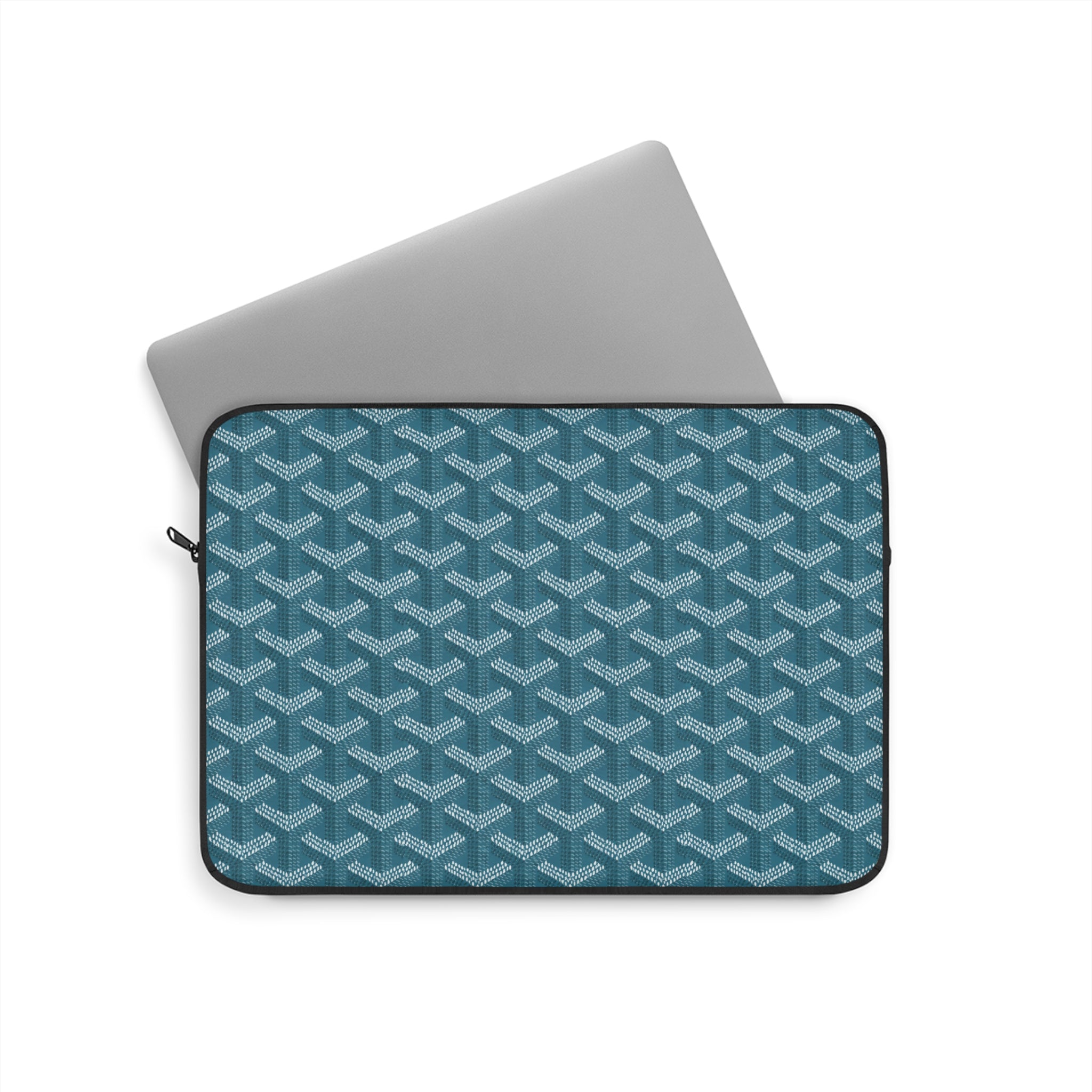 Teal laptop sleeve with geometric lattice pattern and zippered top opening