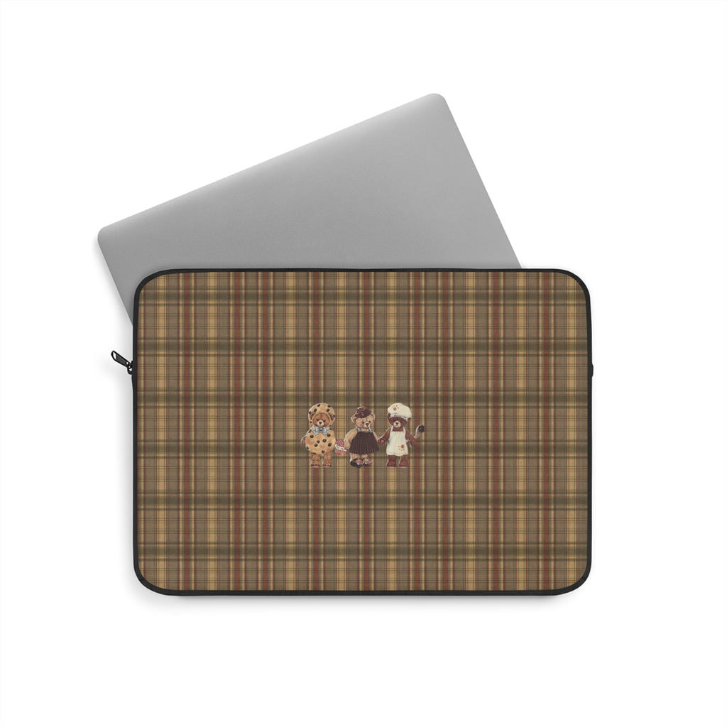 Brown plaid neoprene sleeve with teddy bear appliques and zip closure.