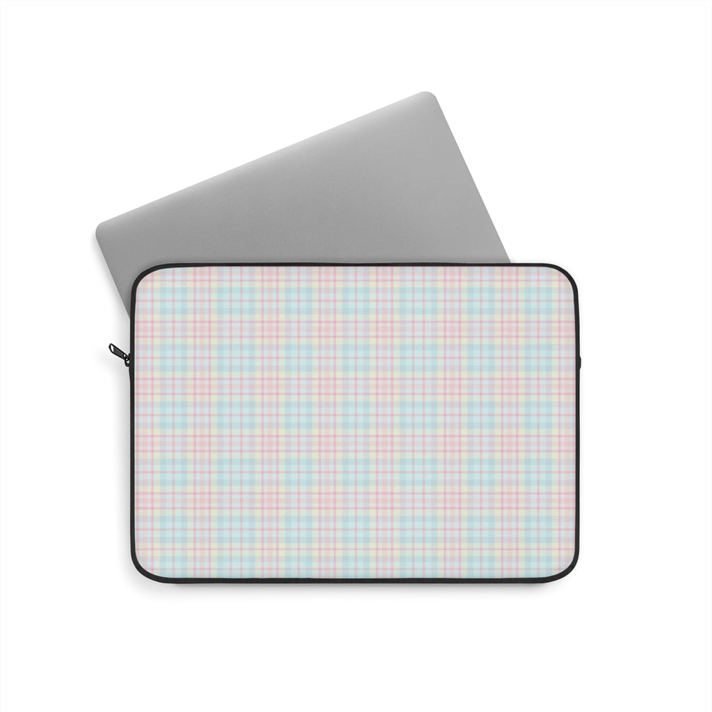 Pastel plaid device sleeve with black zipper and trim; tablet partially visible.