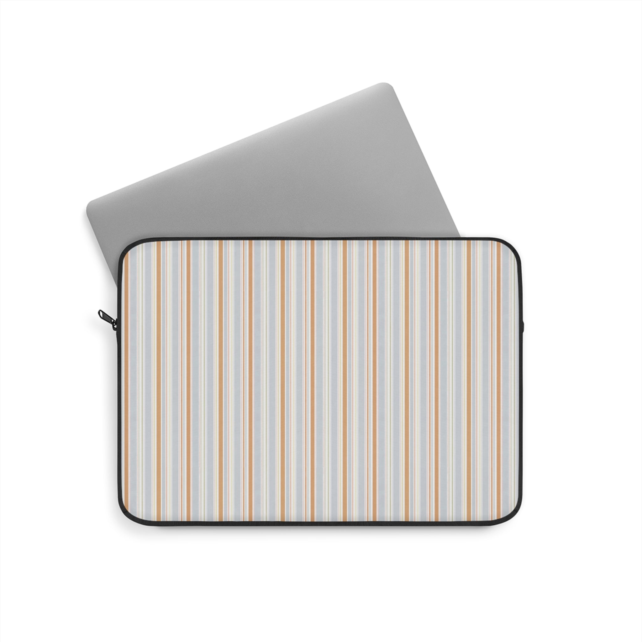 Laptop sleeve with sky-striped fabric, black zipper trim and rounded edge.