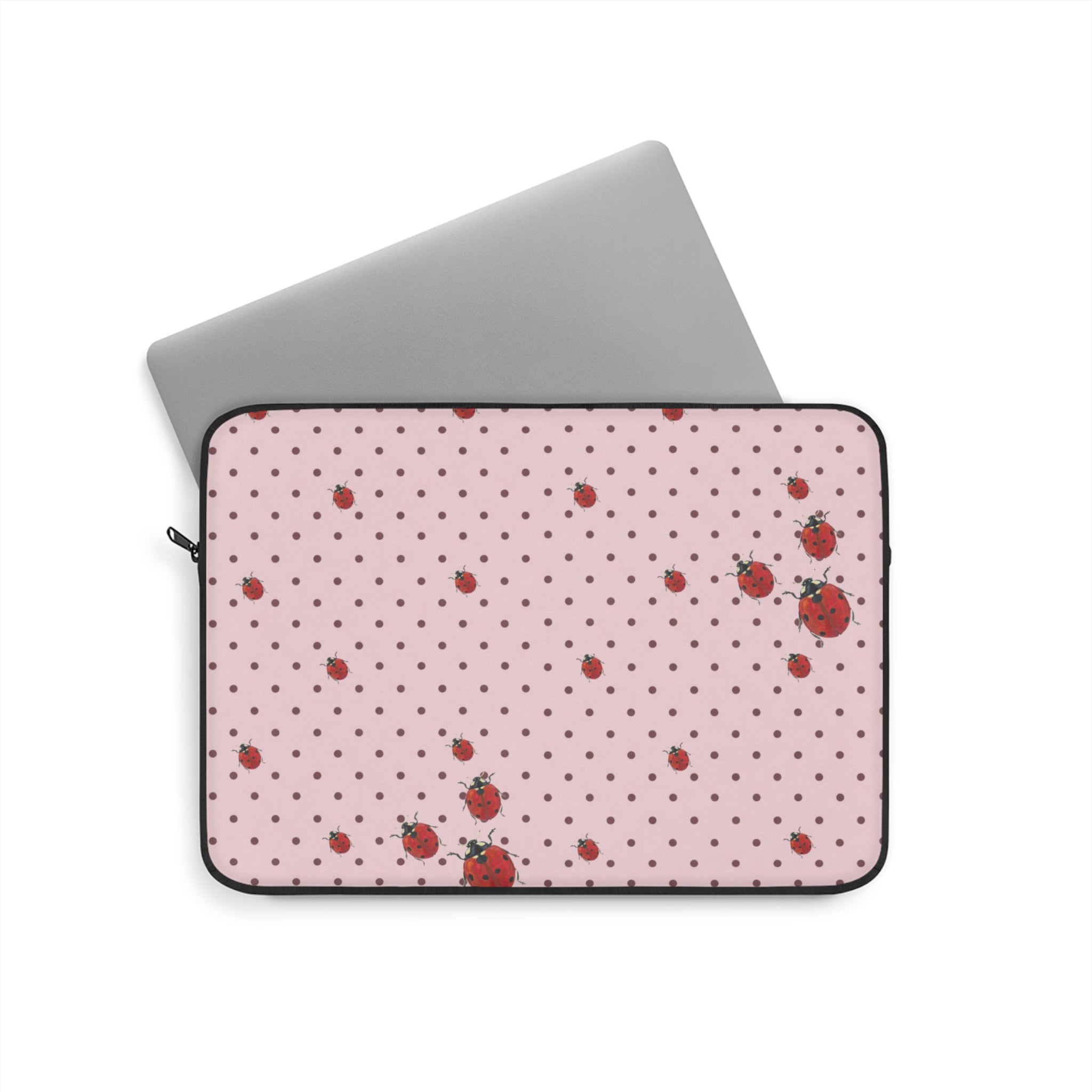 Pink polka dot tablet and laptop sleeve with ladybug print, zippered front