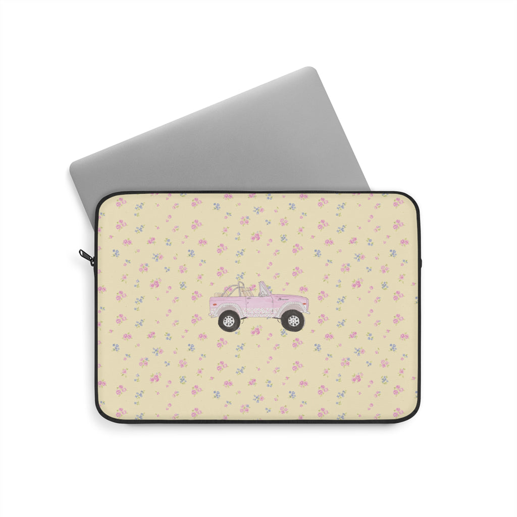 Zippered laptop sleeve with ivory ditzy floral pattern and pink vintage truck graphic