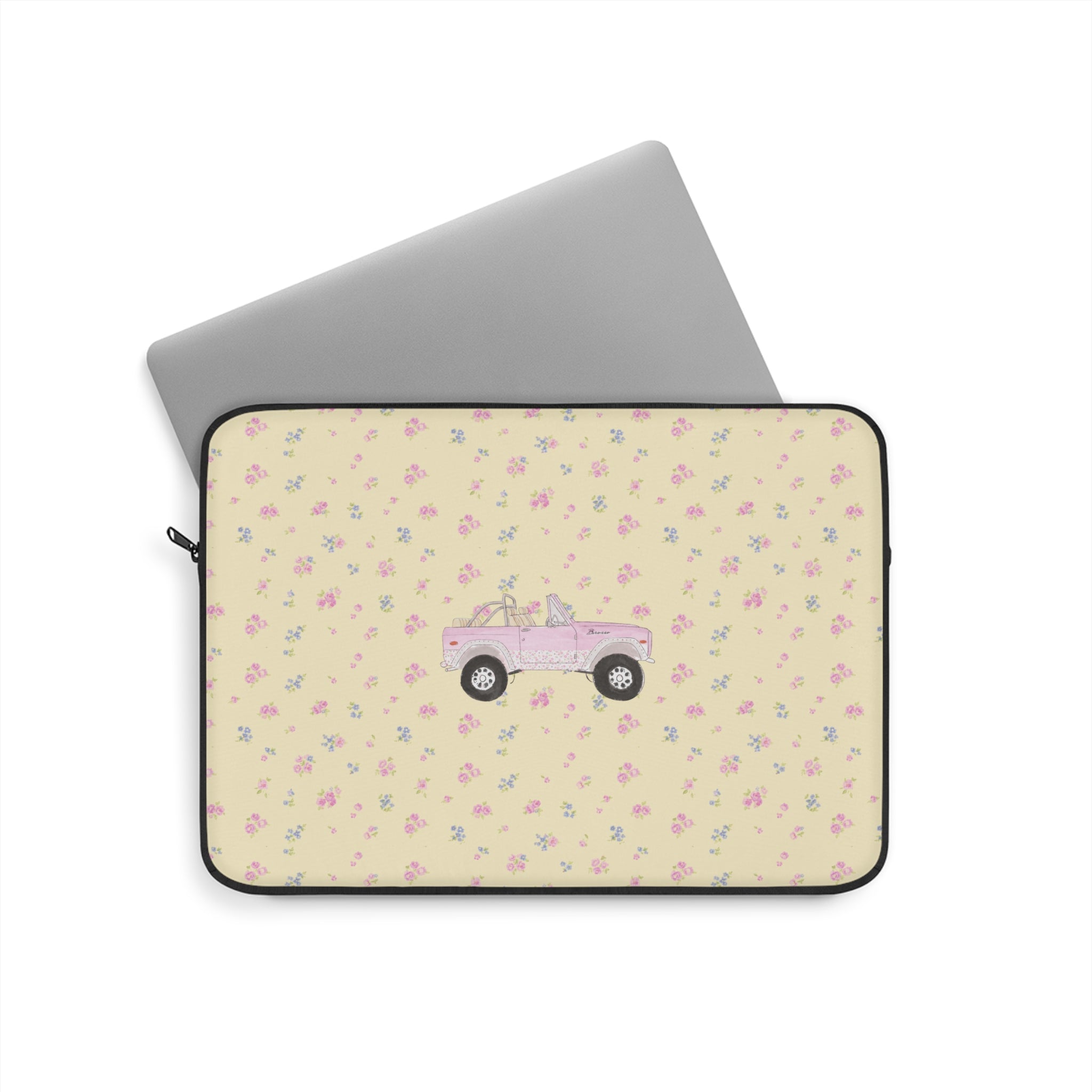 Zippered laptop sleeve with ivory ditzy floral pattern and pink vintage truck graphic