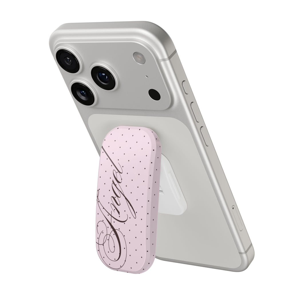 Phone case with pink polka-dot pop grip, coquette script, and side button cutout