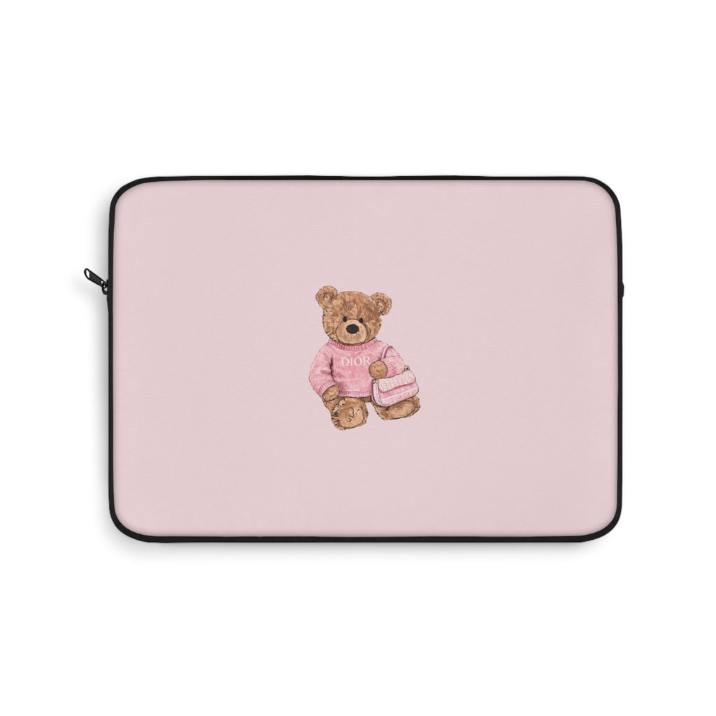Pink neoprene device sleeve with centered teddy bear patch and black trim