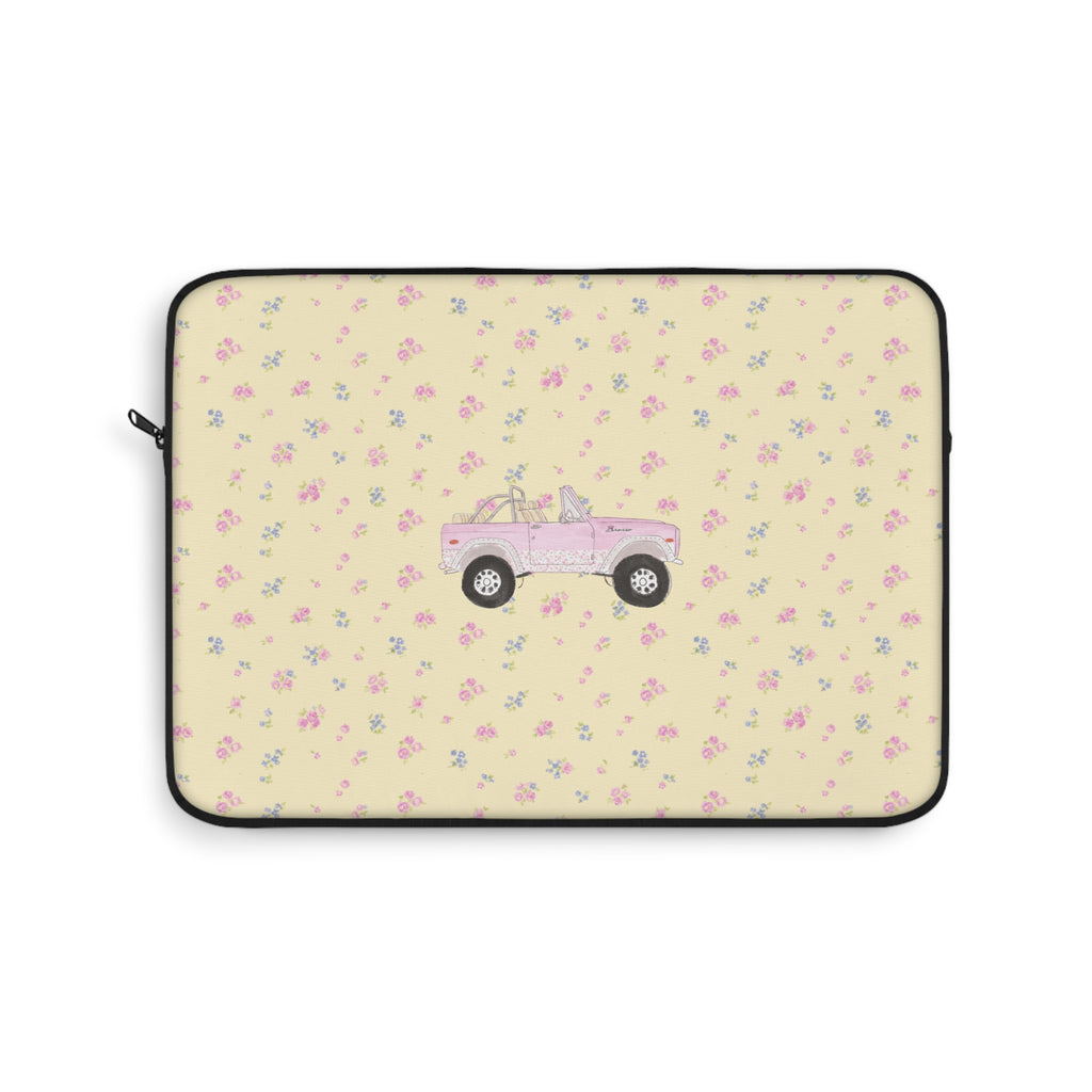 Zippered laptop sleeve with ivory ditsy floral print and pink vintage truck graphic
