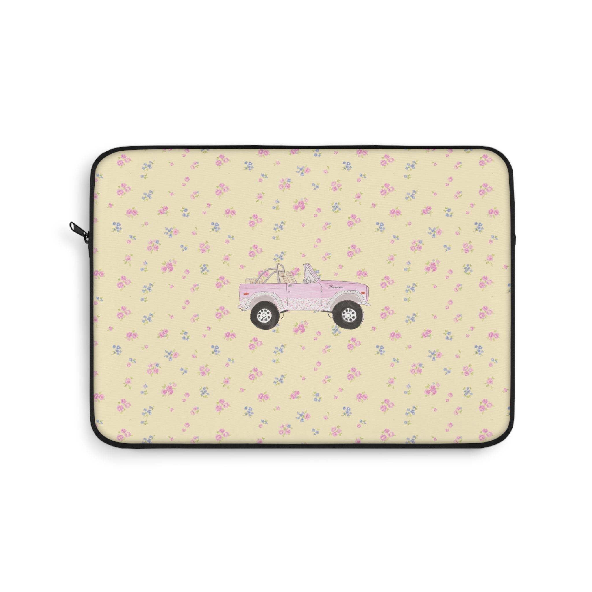 Zippered laptop sleeve with ivory ditsy floral print and pink vintage truck graphic