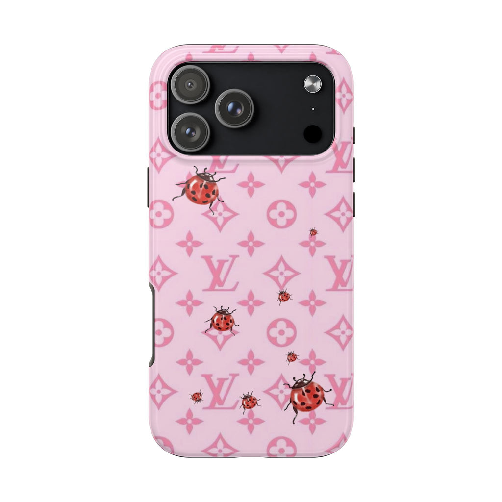 Pink phone case with ladybug print and LV monogram pattern, visible camera cutouts
