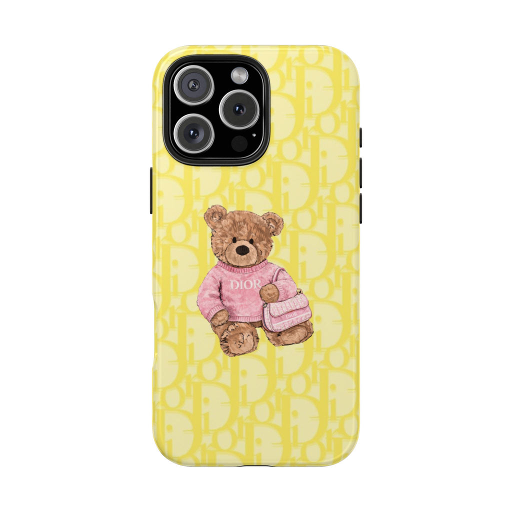 Yellow Dior teddy bear phone case with pink bear holding a small purse