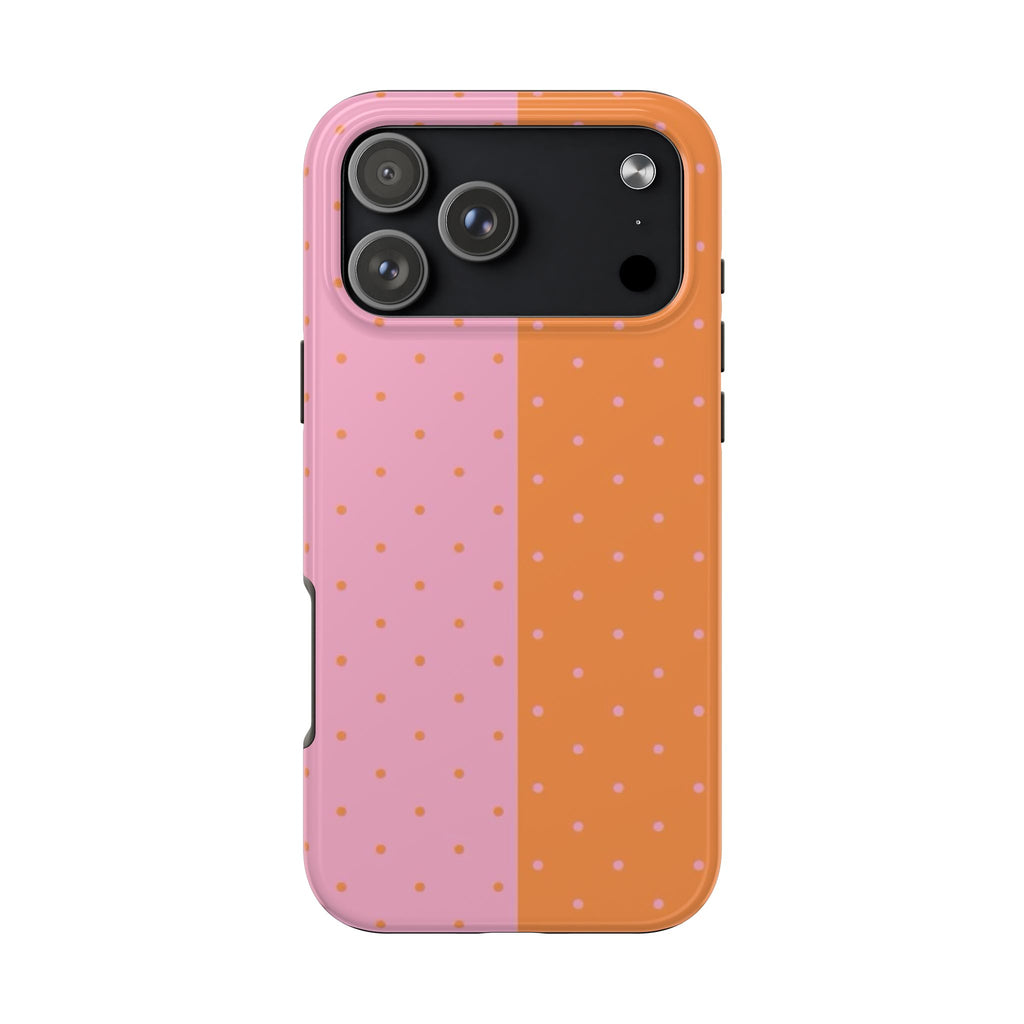 Two-tone phone case with orange and pink polka dots and camera module cutout