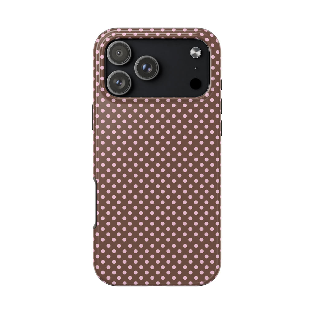 Phone case in mocha-brown with pink and white polka dots, with camera cutout