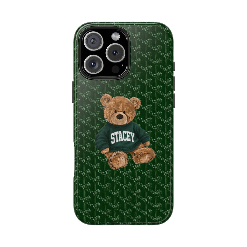 Green patterned phone case with teddy bear wearing a blue shirt labeled Stacey.
