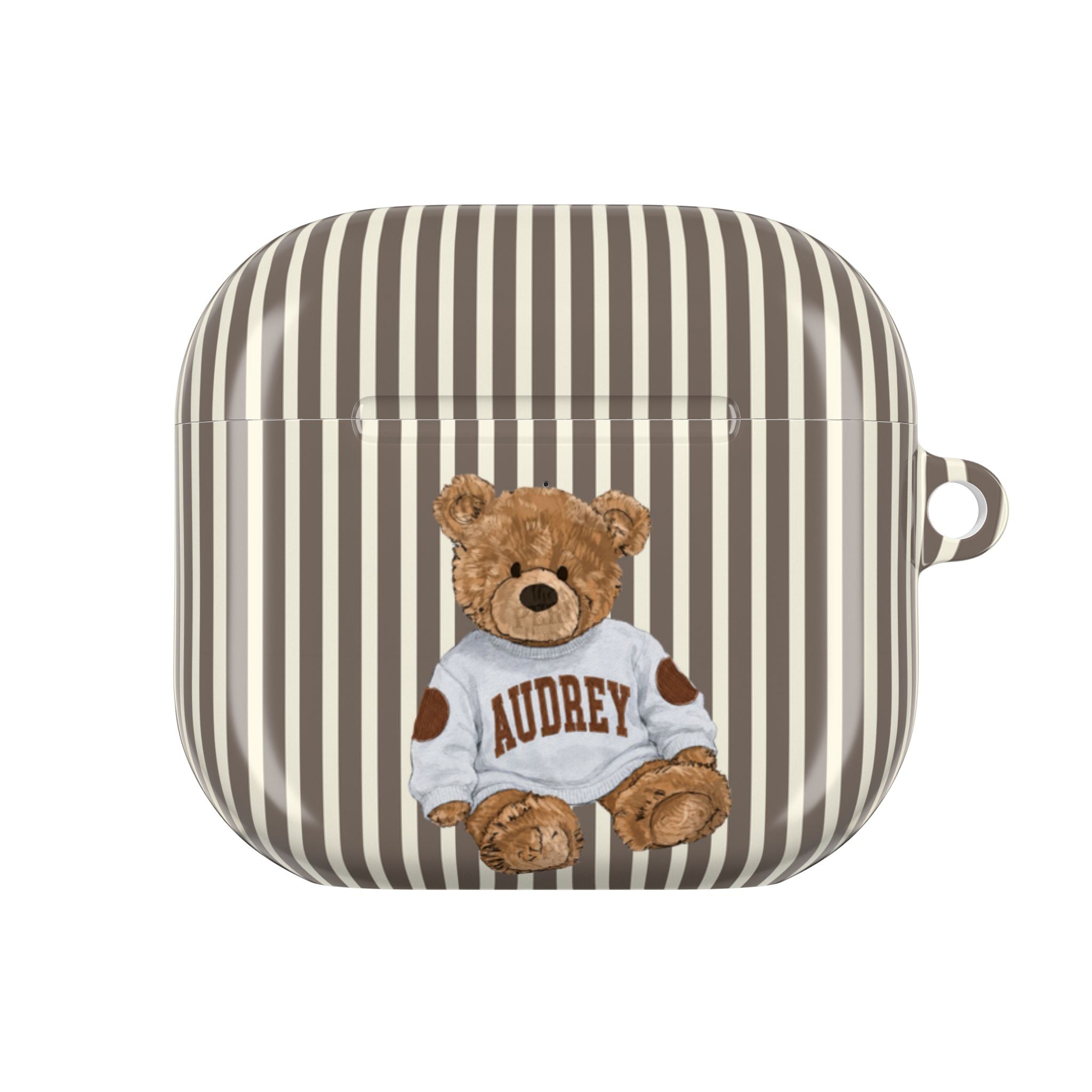 Brown-and-cream striped AirPods case with teddy bear wearing 'AUDREY' shirt