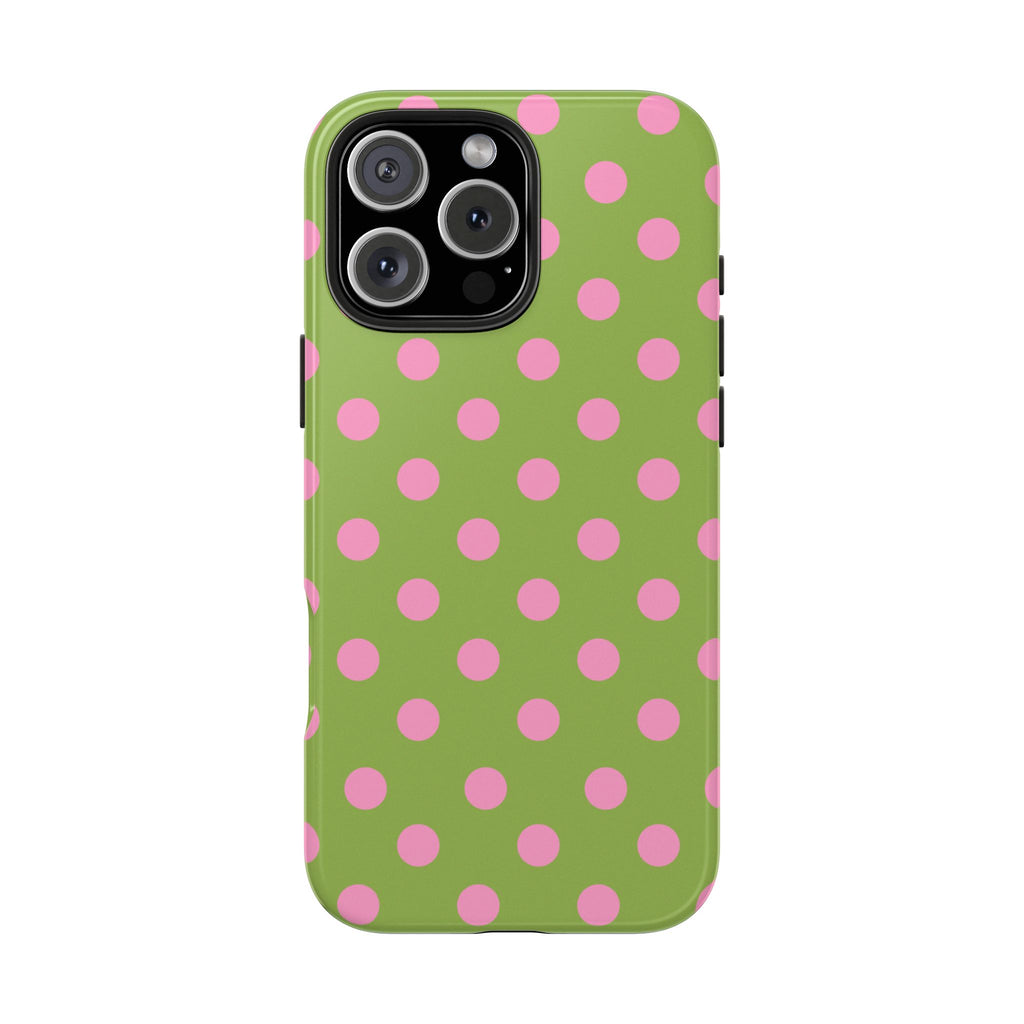 Green phone case with pink polka dots, showing large camera module cutout