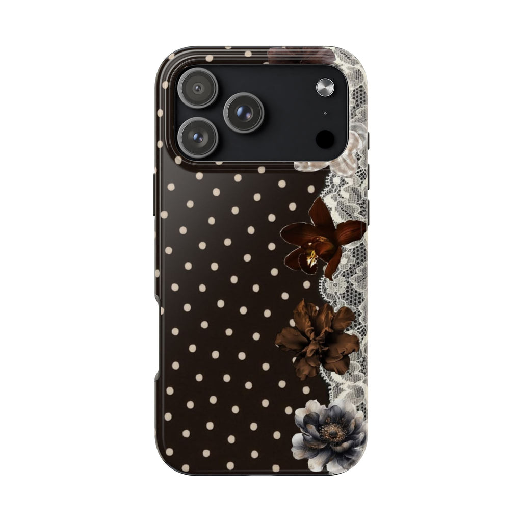Black phone case with white polka dots, lace trim, floral details, and camera cutouts