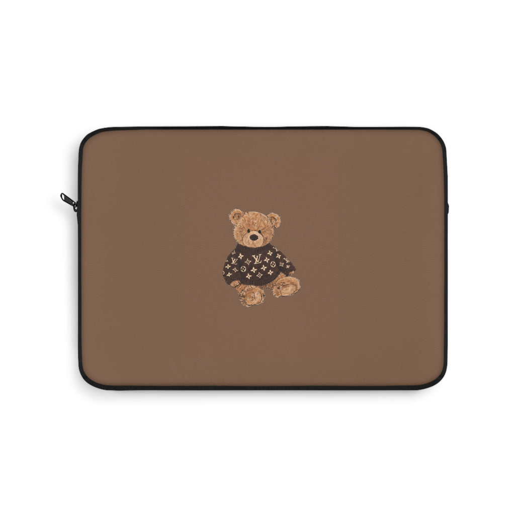 Brown laptop sleeve with teddy bear patch on the front and black trim