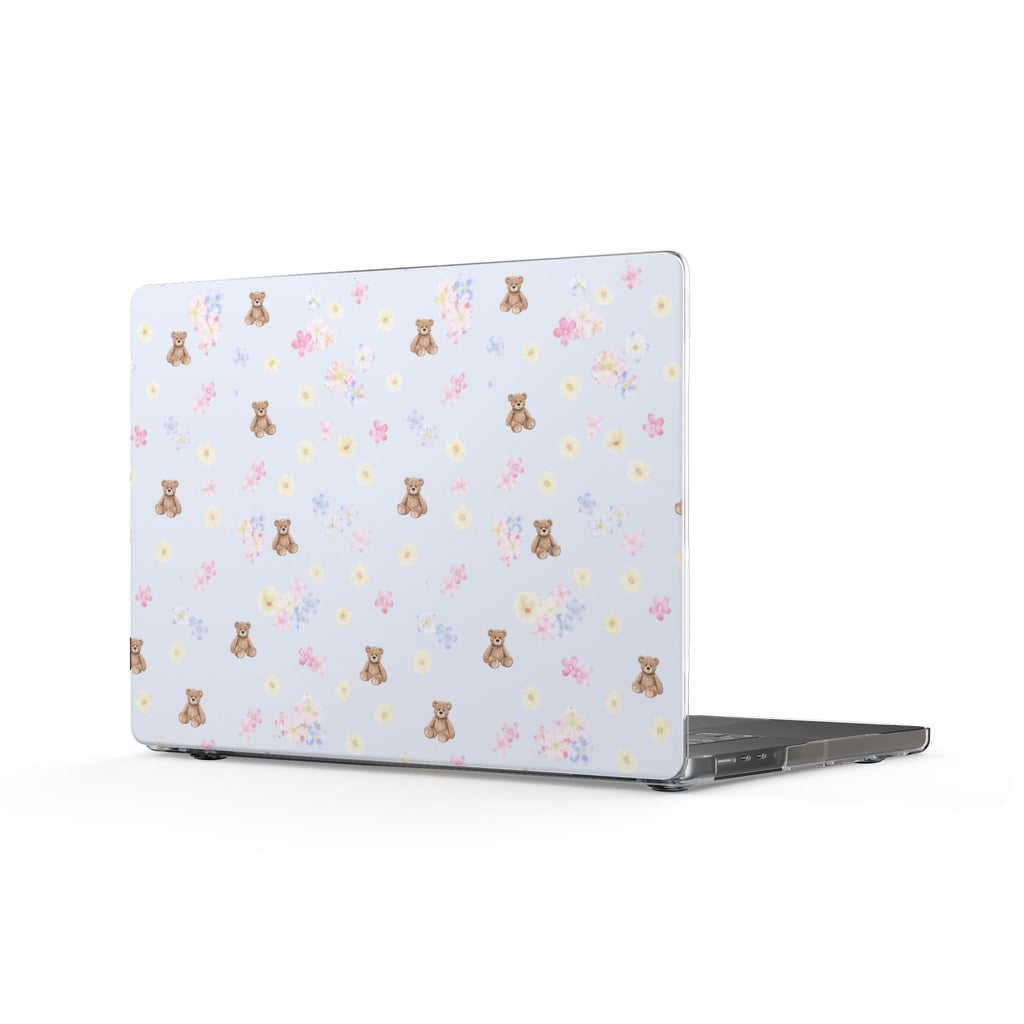 Laptop cover with light blue base and scattered teddy bear and flower pattern