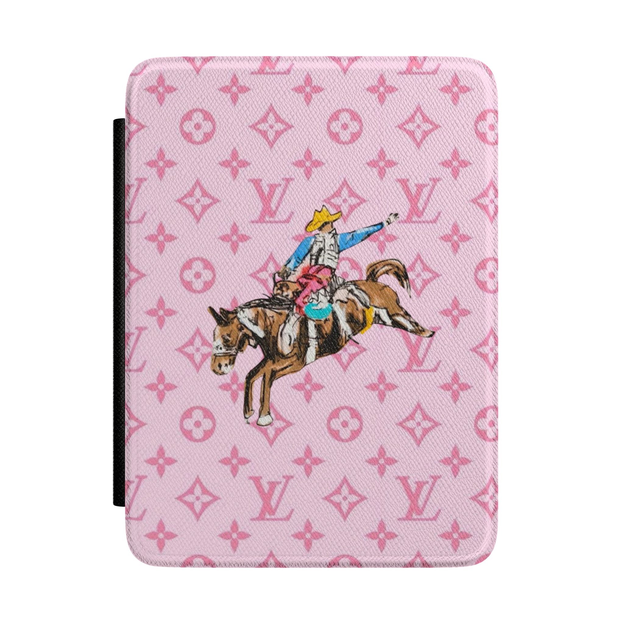 Pink hardcover Kindle case with monogram pattern and cowboy horse graphic