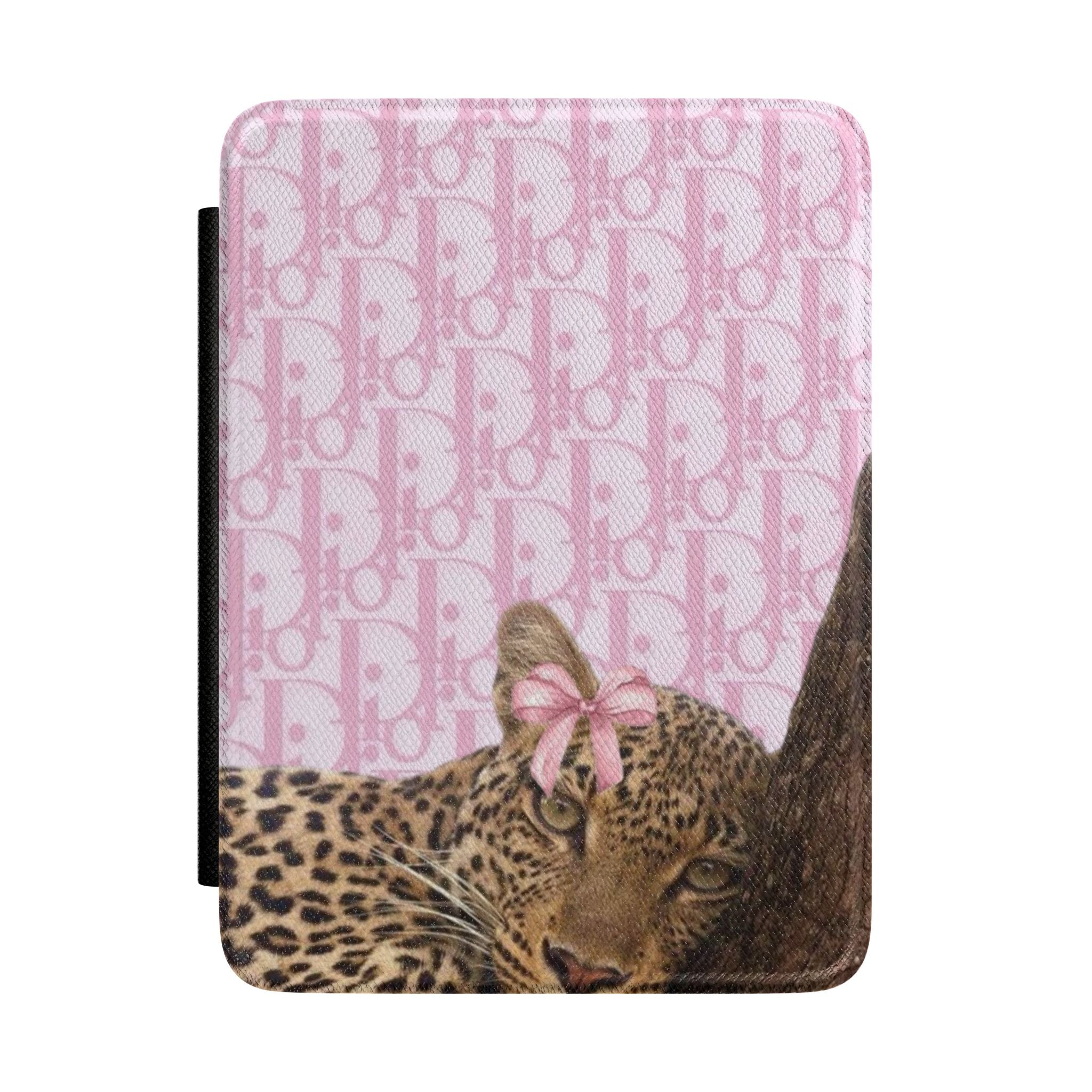 Pink hardcover Kindle case with Dior monogram pattern and leopard cheetah face detail