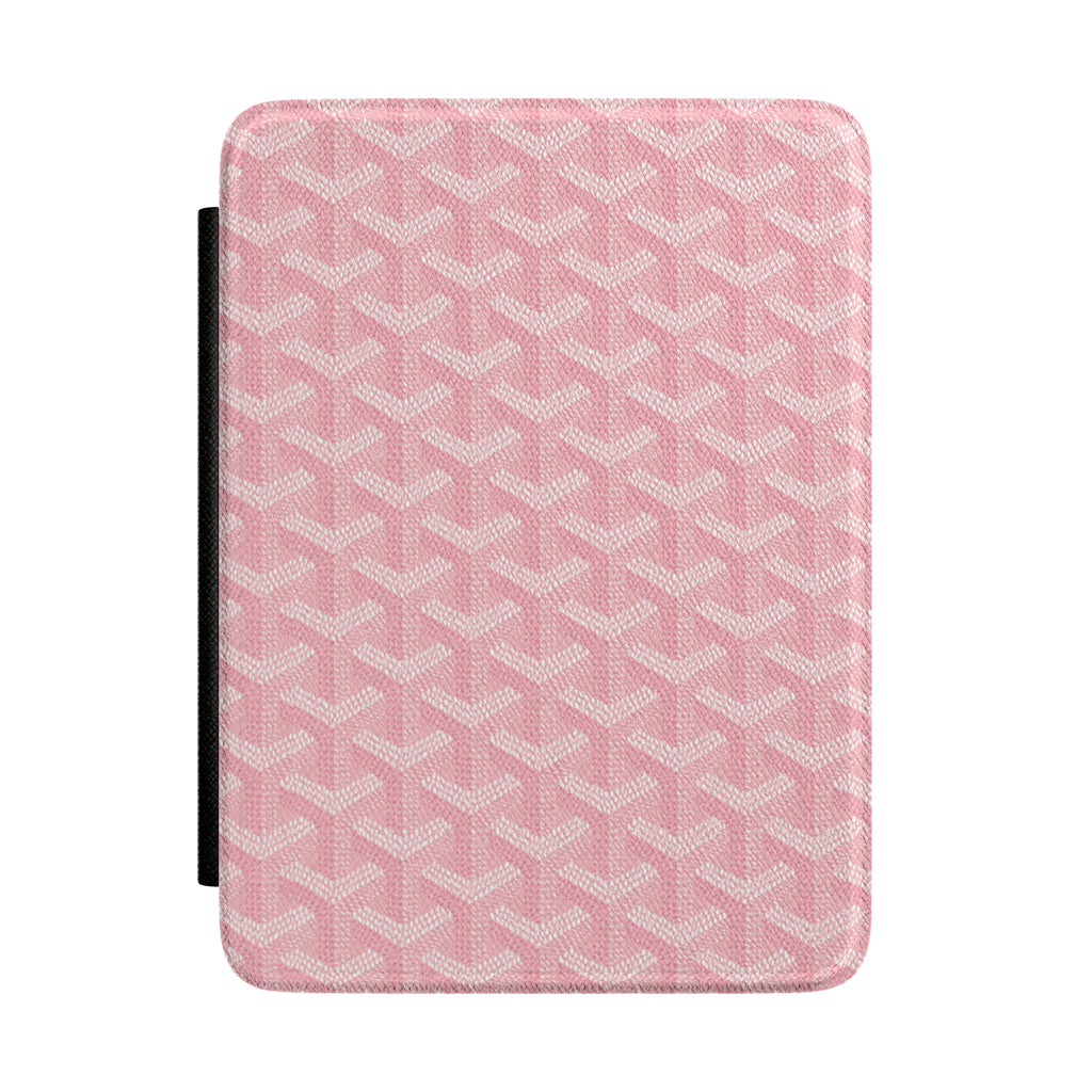 Pink hardcover Kindle case with textured Goyard-style pattern and black side strap