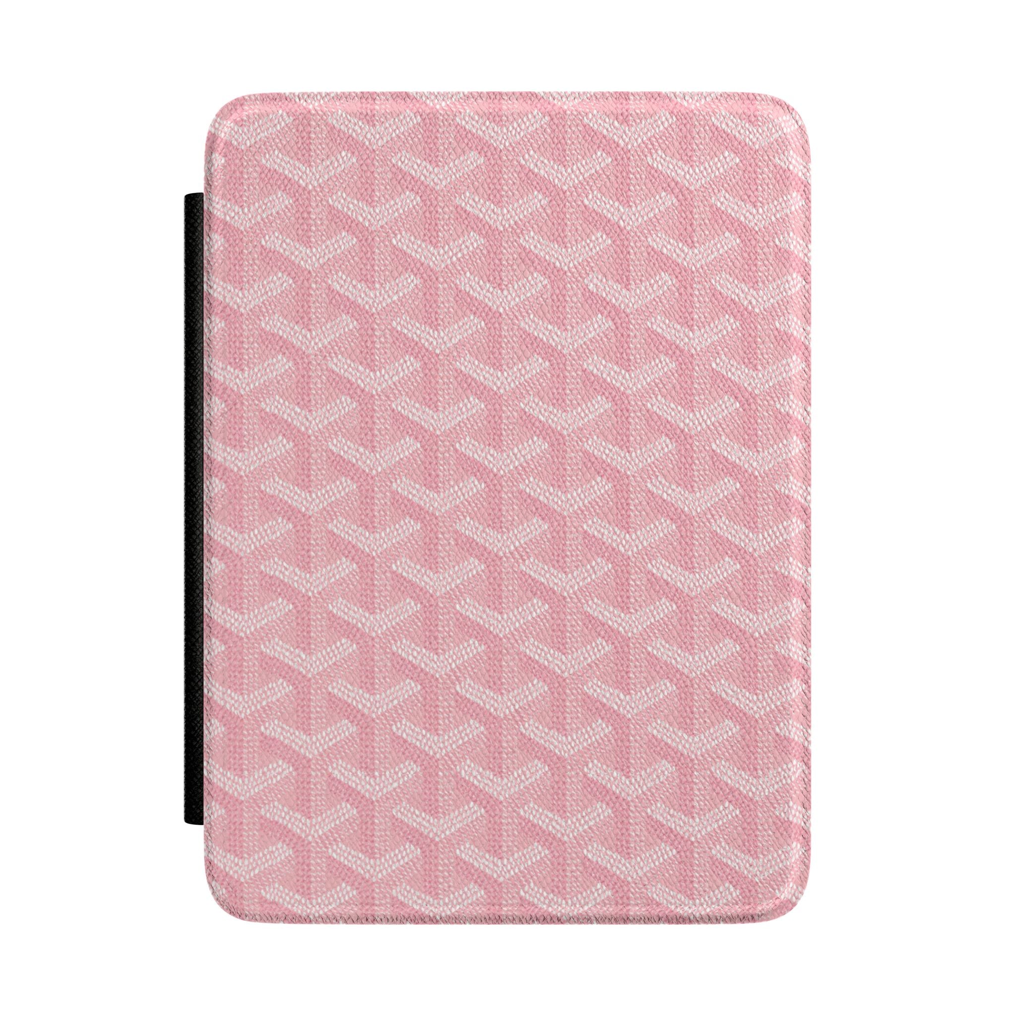Pink hardcover Kindle case with textured Goyard-style pattern and black side strap