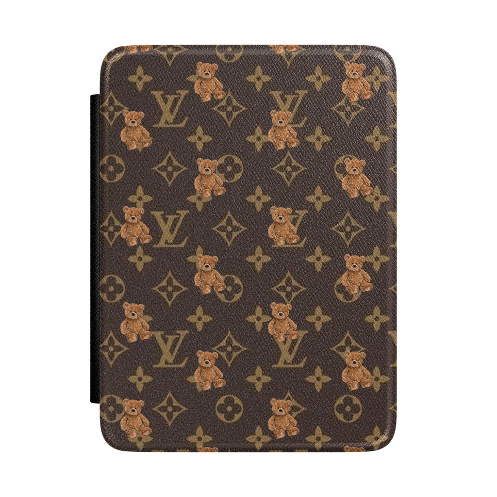 Hardcover Kindle case with brown monogram print, teddy bear motifs, and black side strap