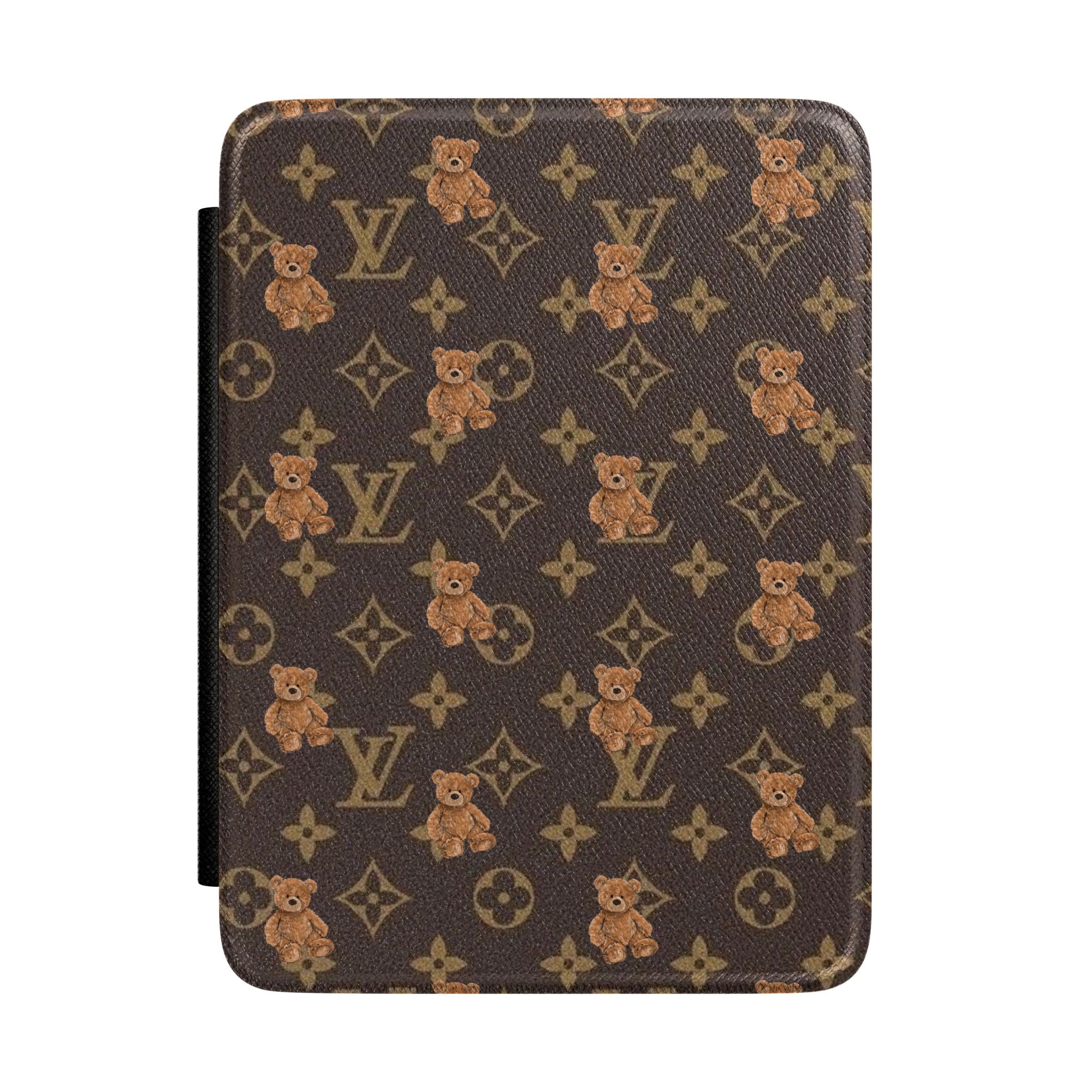 Hardcover Kindle case with brown monogram print, teddy bear motifs, and black side strap