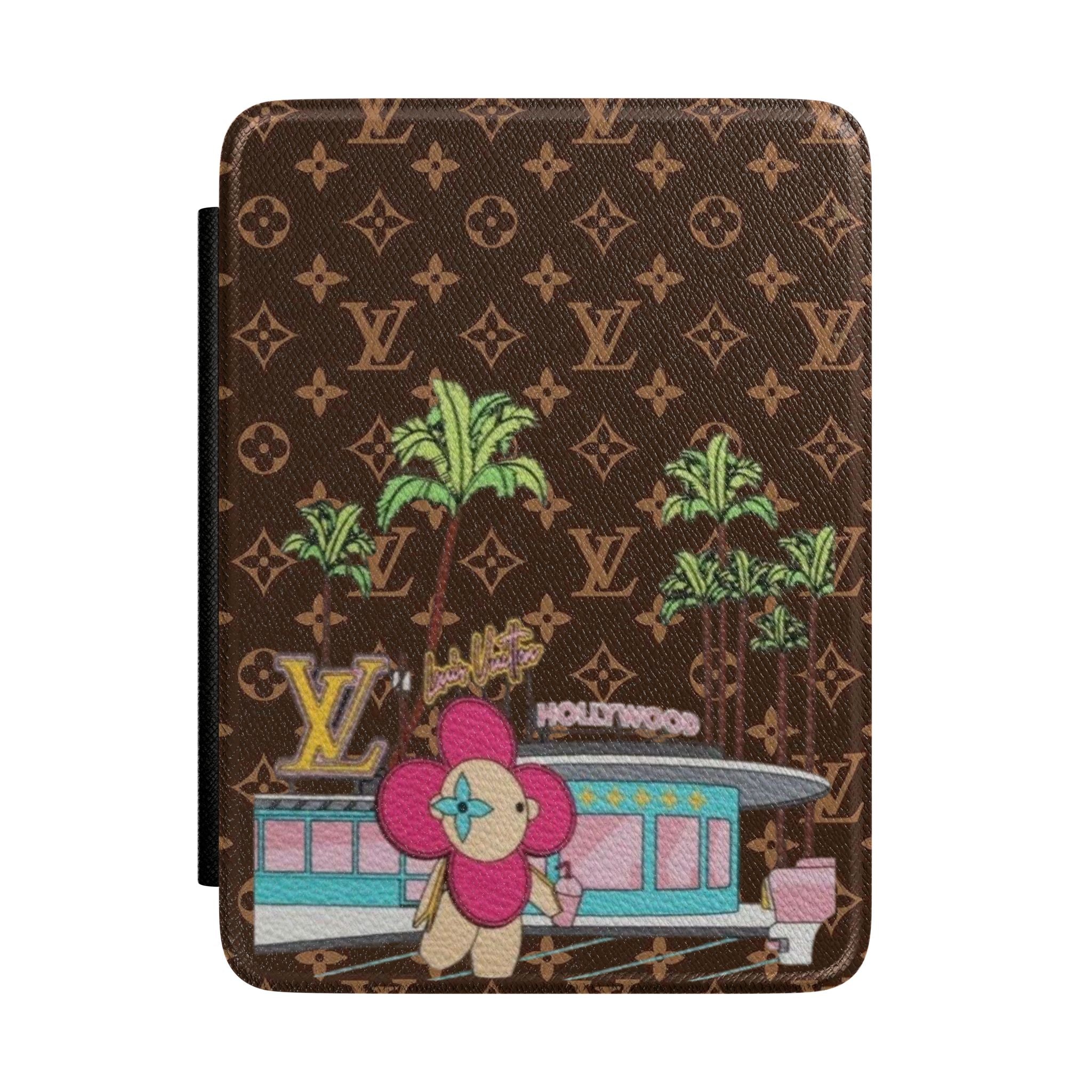 Hardcover Kindle case with brown monogram pattern and colorful character illustration