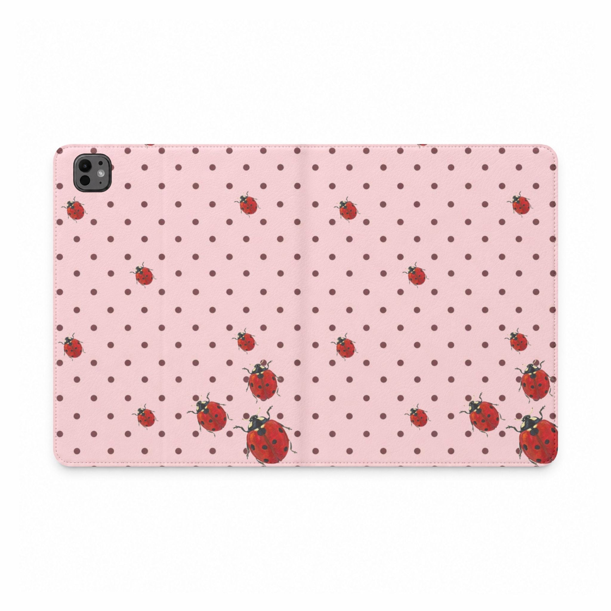 Pink polka dot tablet folio case with scattered ladybugs pattern