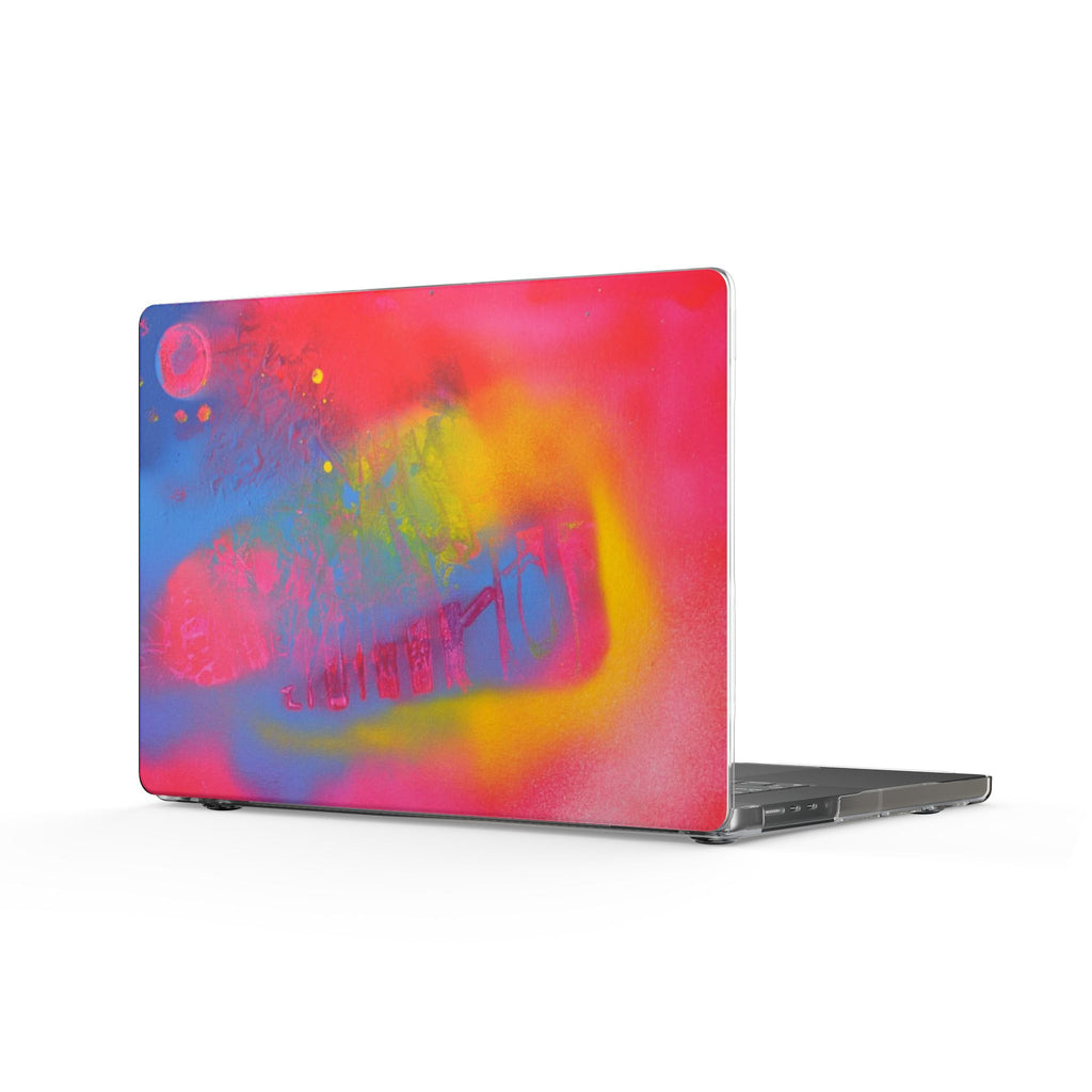 Colorful holographic MacBook shell cover with red, pink, yellow, and purple splash design
