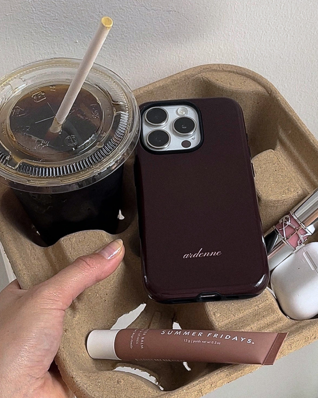 Plum phone case with 'ardenne' text and camera cutouts.