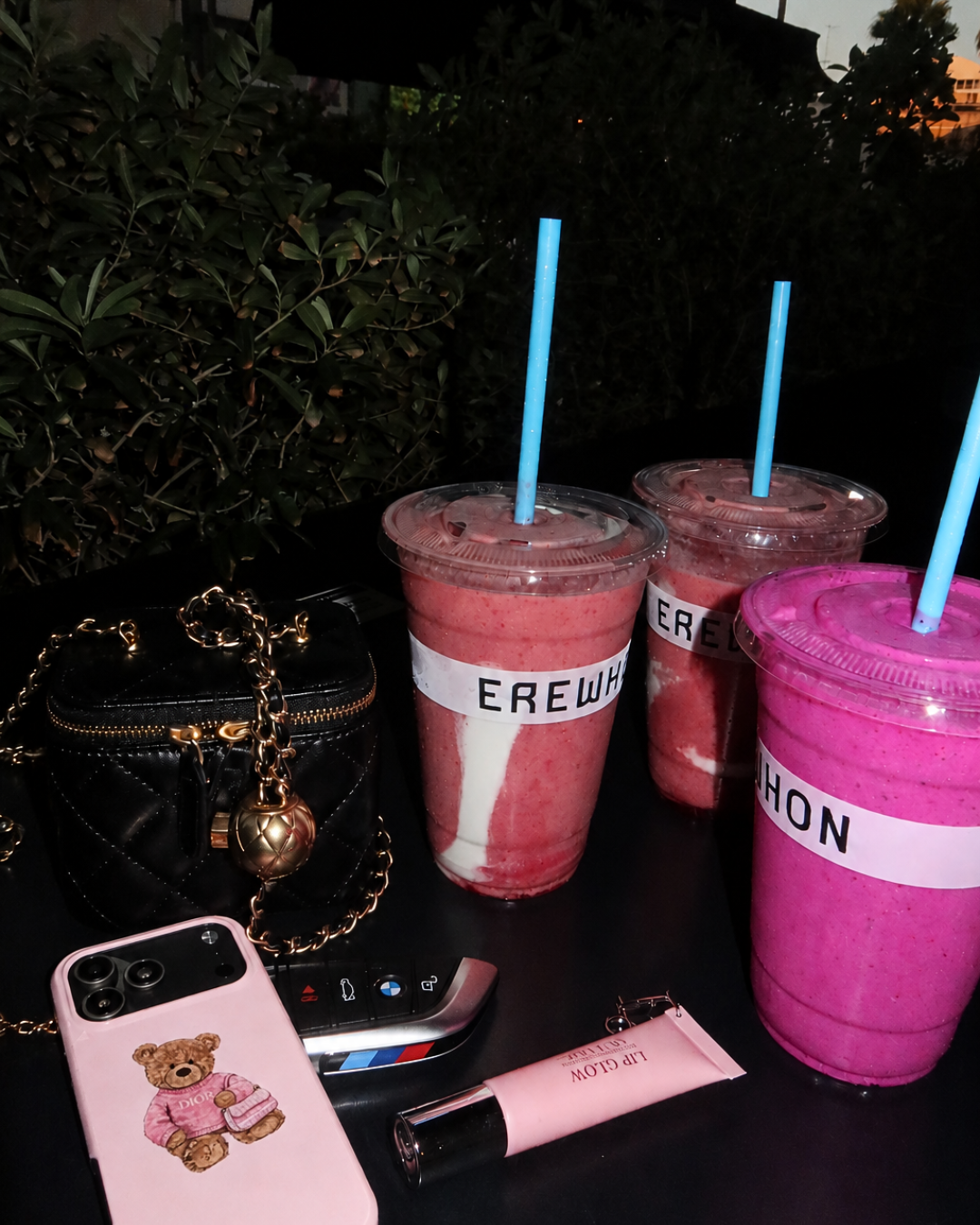 Pink Dior teddy bear phone case with teddy graphic on the back