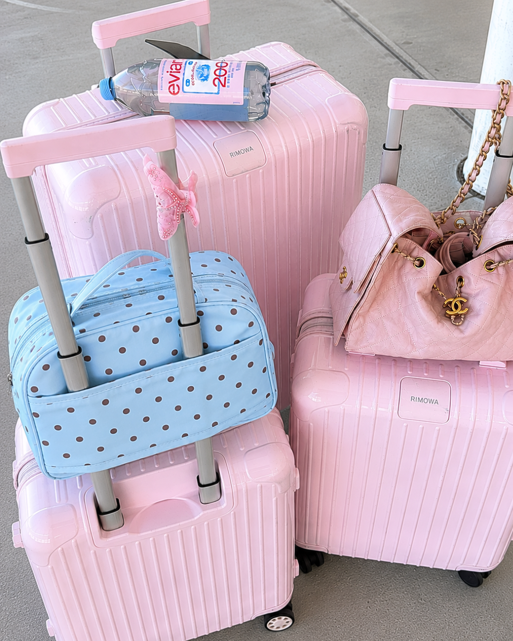Light blue polka dot travel organizer bag with top handles and zip pocket