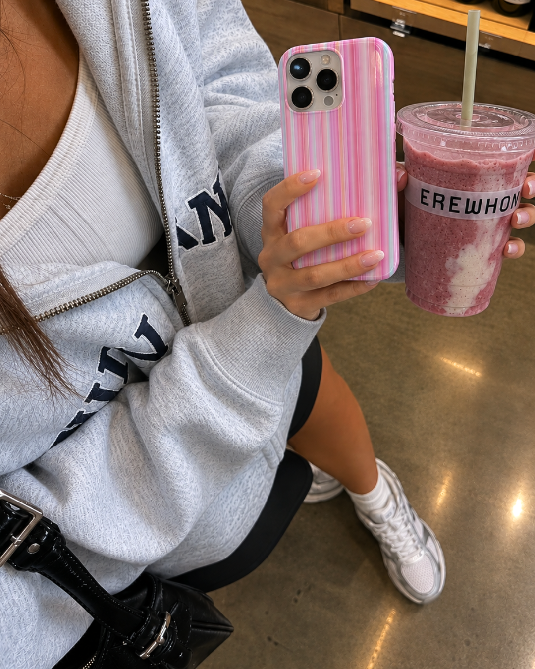 Pink vertical striped phone case with raised camera cutouts and smooth finish