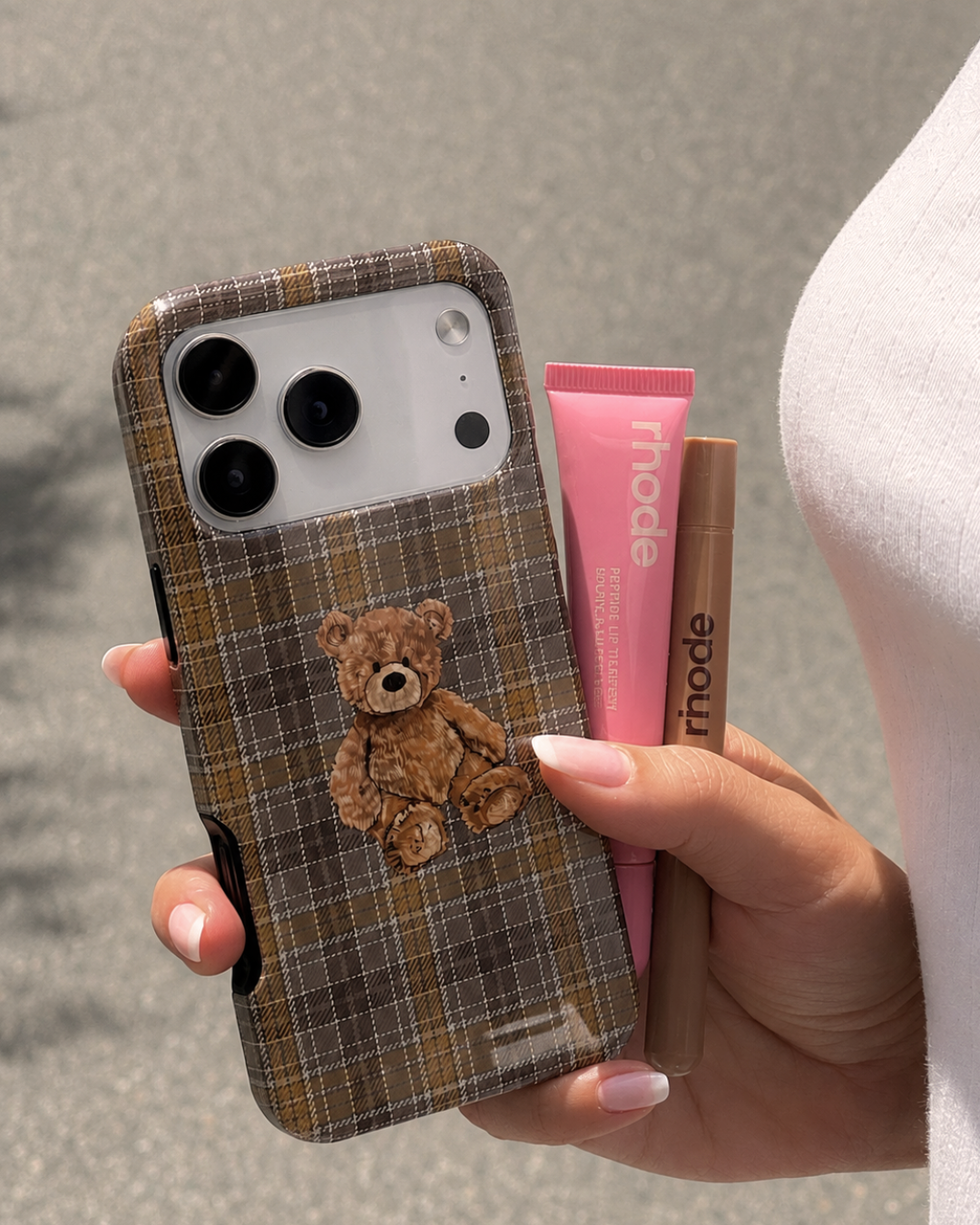 Brown plaid phone case with teddy bear patch and camera cutouts