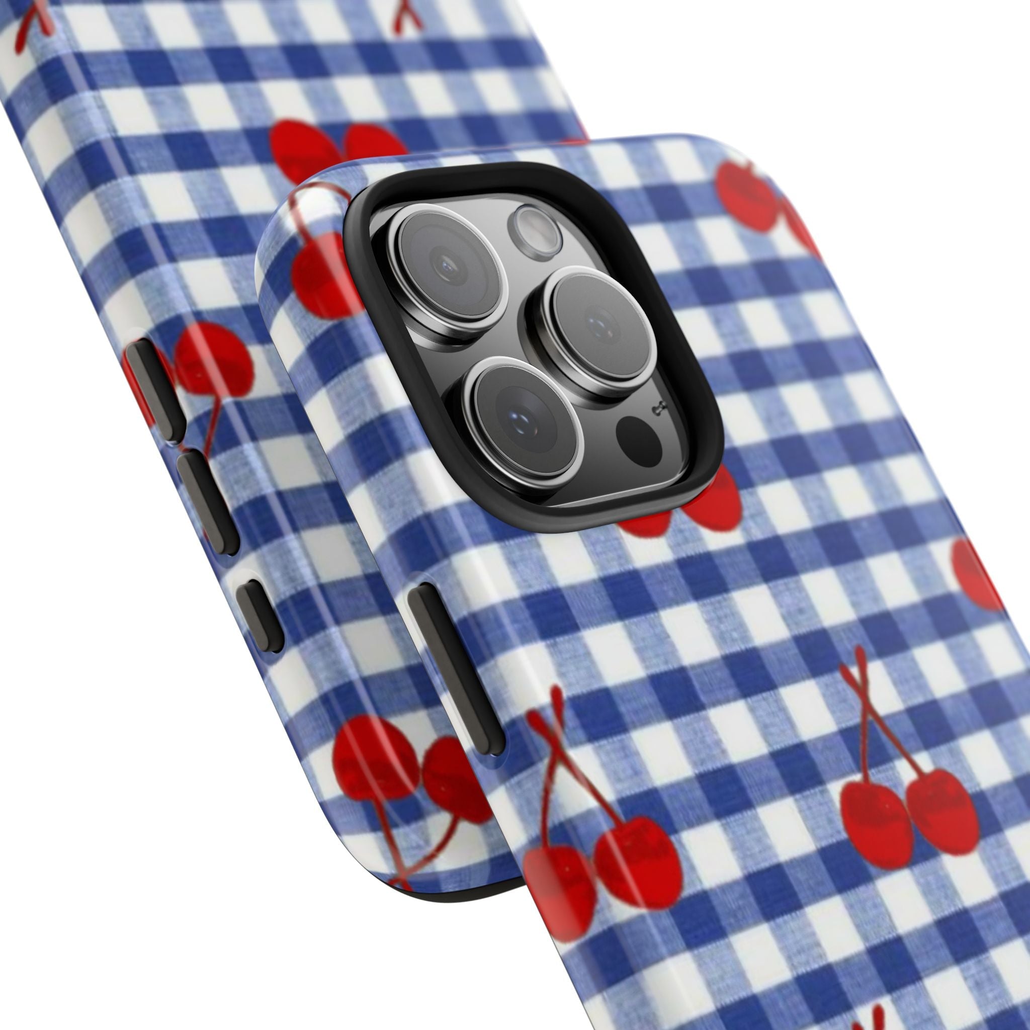 Blue gingham phone case with red cherries, angled view of camera lenses