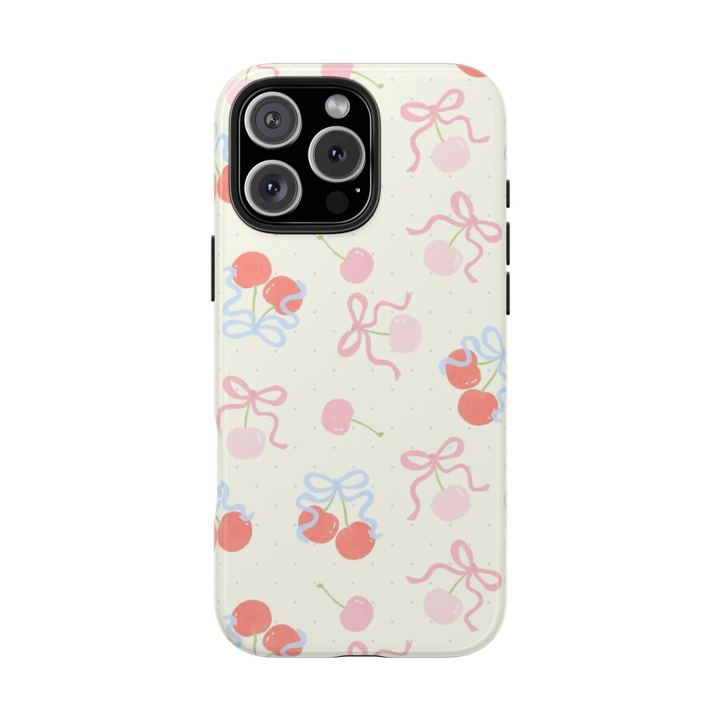 Off-white phone case with repeating cherries and bow shapes in pink, blue, and coral; back