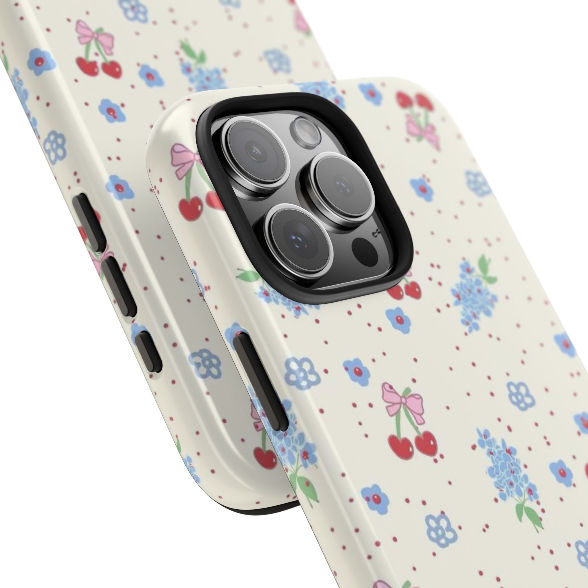 Floral phone case detail view, cream with blue flowers; side buttons and camera openings