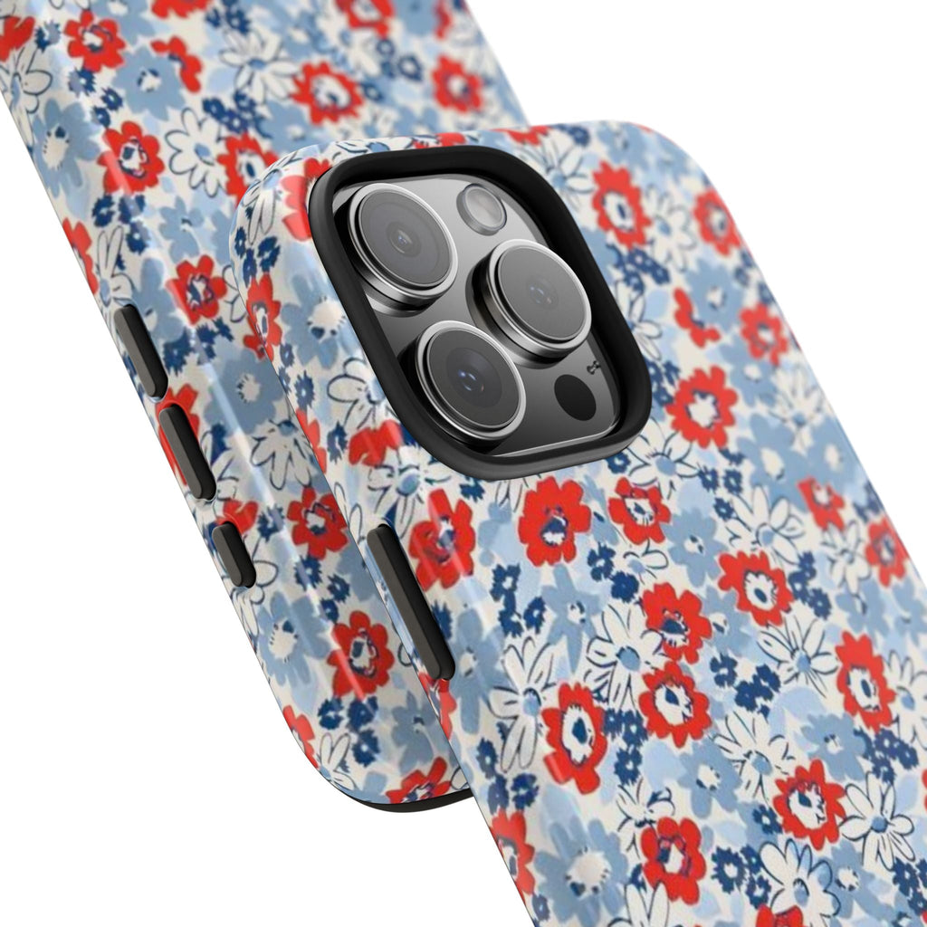 Light blue floral phone case with red and white flowers; raised camera and side buttons