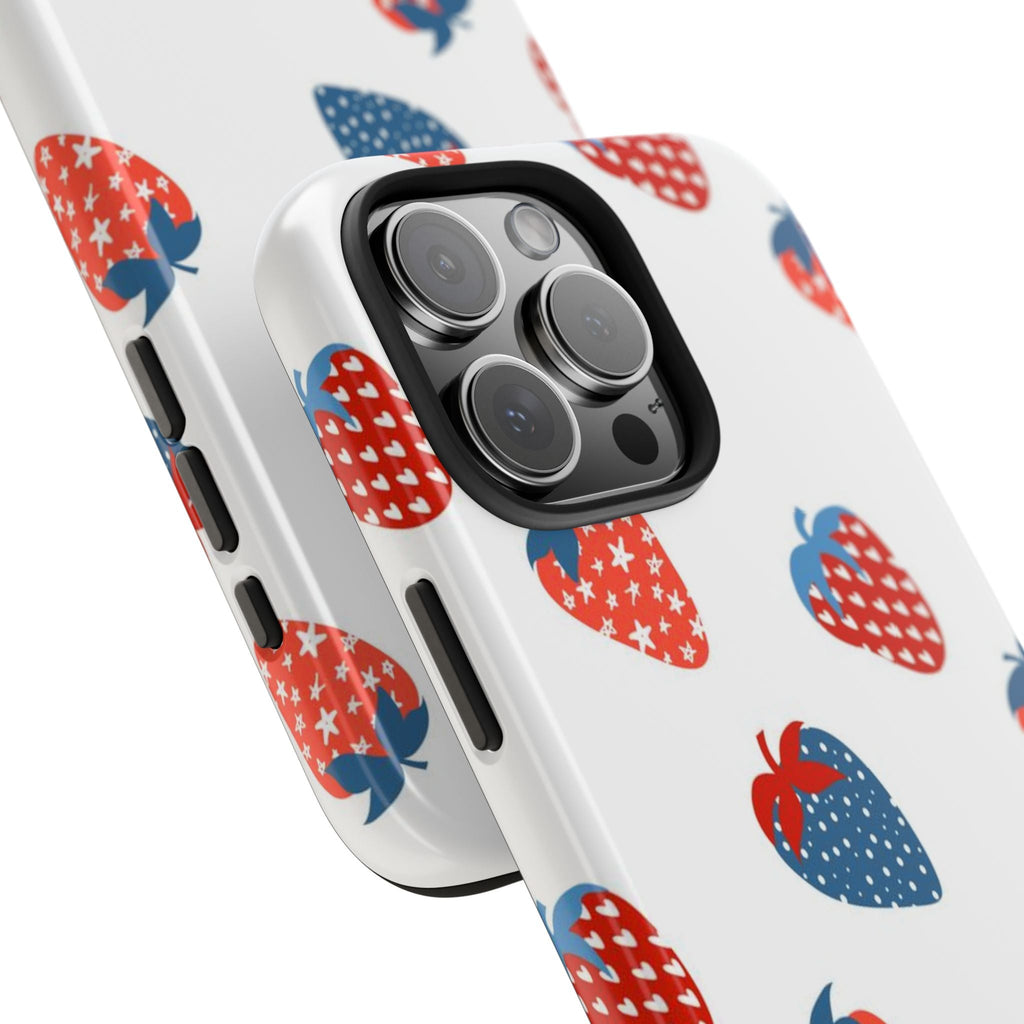 Angled view: white case with red and blue strawberries, side button cutouts