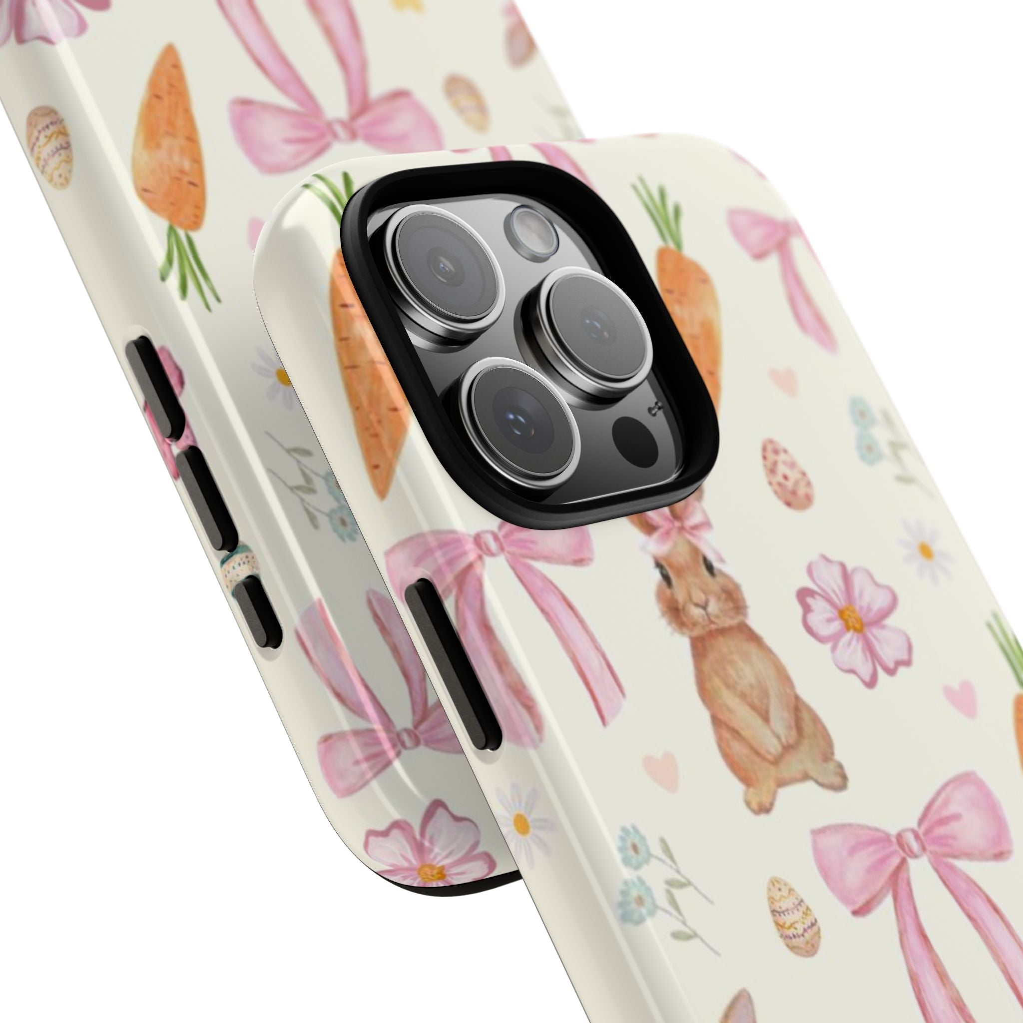 Cream rabbit phone case with carrots, pink bows, and flowers; angled view of camera rim
