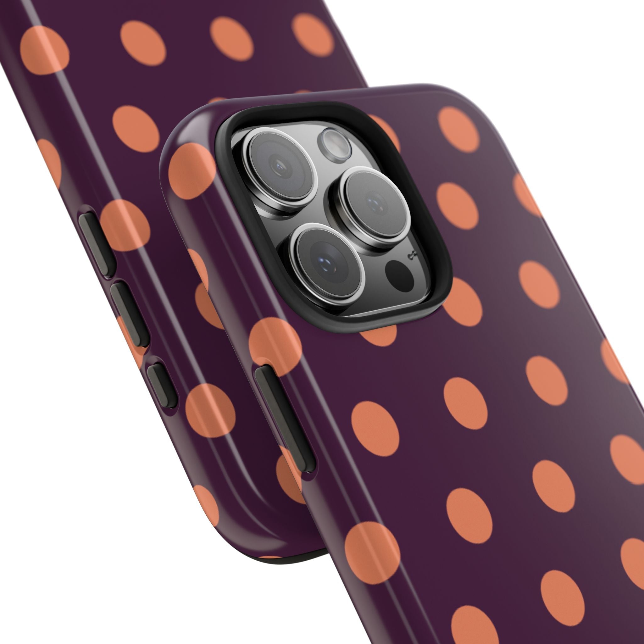 Orange polka dot aubergine phone case with raised camera bump and side buttons