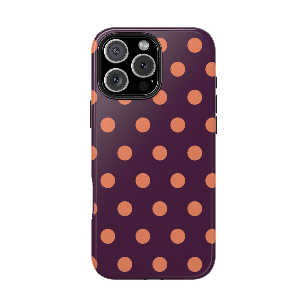 Aubergine phone case back with orange polka dot pattern and camera lens openings