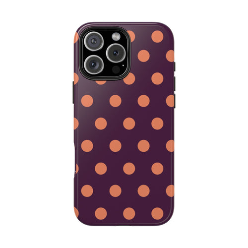 Aubergine phone case back with orange polka dot pattern and camera lens openings