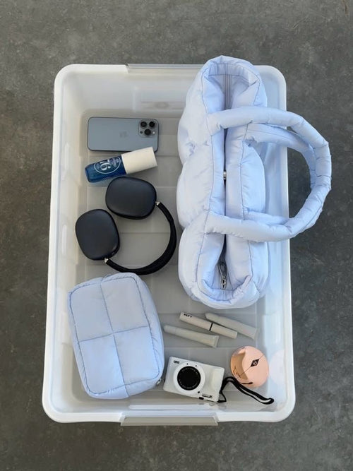 Baby blue cloud puffer duffle tote bag, quilted padded exterior and zip closure