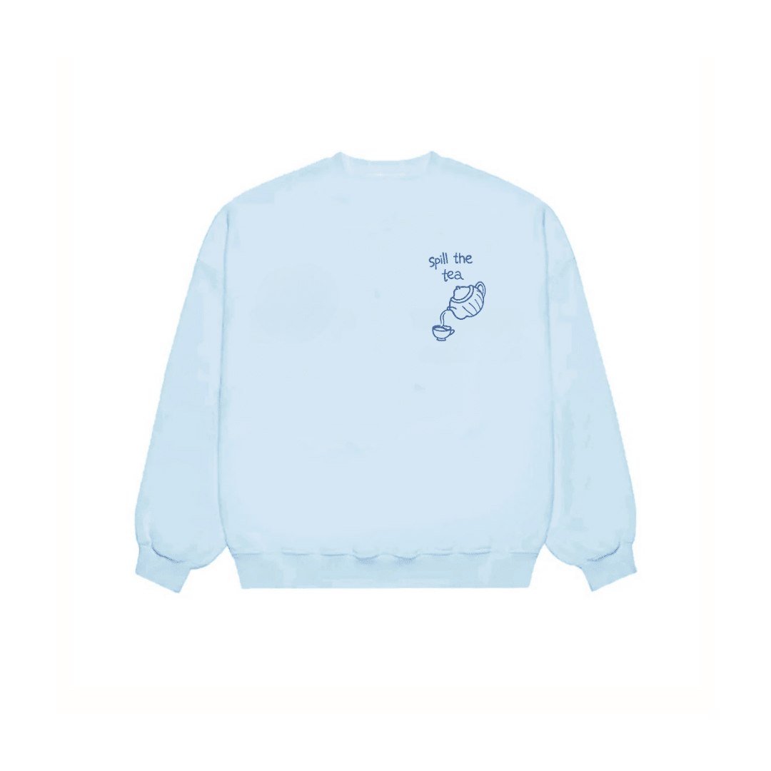 Baby blue crewneck sweatshirt with “Spill the tea” chest graphic