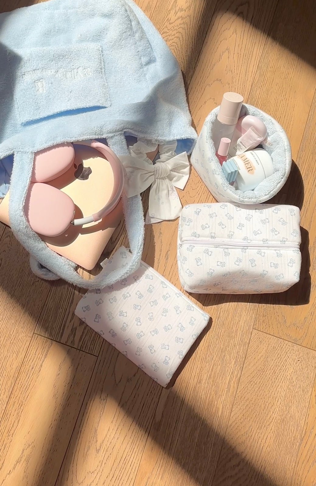 Baby blue teddy bear organizer set: open tote, long pouch and bow-wrapped items